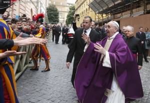 Pope Francis greets people after celebrating Mass at St. Anne's Parish within Vatican